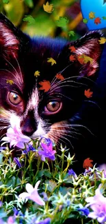 Adorable kitten with purple flowers and a blue heart.