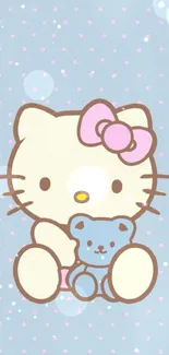 Cute kitty with teddy bear on blue polka dot wallpaper.