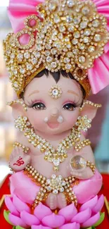 Cute Krishna figurine wallpaper with pink lotus and gold jewels.