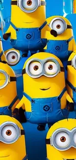 Playful cartoon minions in blue overalls on a vibrant wallpaper.
