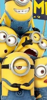 Six cheerful yellow Minions posing in blue denim overalls.