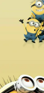 Adorable Minions on light yellow background.