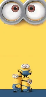 Minions standing on a yellow background, perfect for a fun mobile wallpaper.