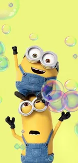 Two playful minions with bubbles on a bright yellow background.