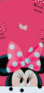 Minnie Mouse with pink bow and polka dots on vibrant background.