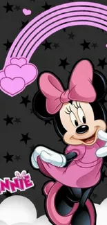 Minnie Mouse with pink and black themed wallpaper.