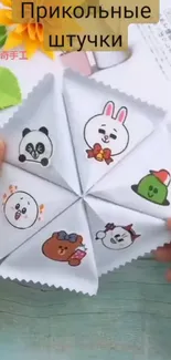 Colorful origami wheel with cute animal faces on a playful background.