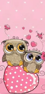 Two cute owls on a pink heart with polka dots, perfect wallpaper for mobiles.