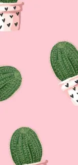 Pink wallpaper with potted green cactus featuring heart designs.