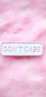 Pink furry wallpaper with 'Don't Care' patch.