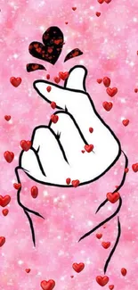 Cute hand gesture with hearts on a pink sparkling background wallpaper.