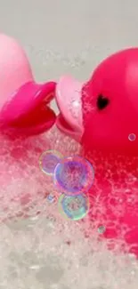 Two pink rubber ducks with heart eyes in a bubbly bath.