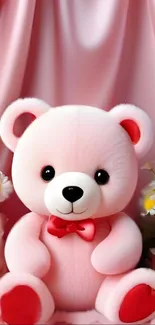 Adorable pink teddy bear with floral accents on a soft pink background.