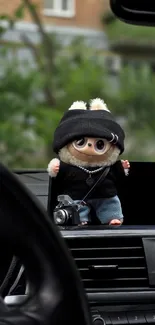 Plush toy with camera on car dashboard.