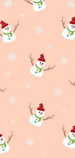 Cute snowman wallpaper with a peach background.