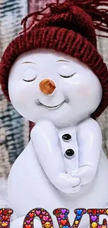 Cute snowman with red hat and 'LOVE' letters in colorful design.