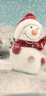 Adorable snowman with red hat and scarf in snowy scene.