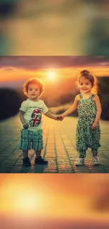 Two children holding hands at sunset with warm colors.