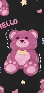 Cute pink teddy bear on dark wallpaper with hearts and bows.