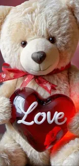 Cute teddy bear holding red heart with 'Love'.