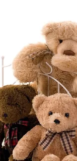 Adorable teddy bear wallpaper with plush brown and beige toys.