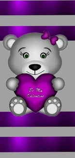 Grey teddy bear holding a violet heart on a striped background.