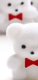 Adorable white teddy bear with red bowtie on a minimal background.