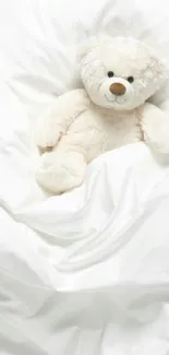 Adorable teddy bear on a soft white background, perfect for a cozy mobile wallpaper.