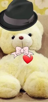 Teddy bear with hat, bow tie, and heart on sofa