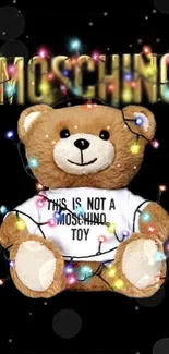 Cute teddy bear with lights and Moschino text on black background.