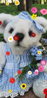 Cute teddy bear in blue dress with flowers in forest setting.