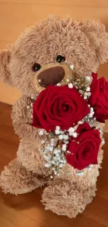 Cute teddy bear holding red roses on wooden floor.