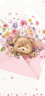 Teddy bear in a pink envelope with colorful flowers.