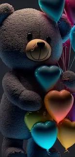 Teddy bear holding colorful heart-shaped balloons.