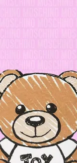 Cute toy bear on pink background wallpaper.