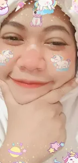 Smiling face with cute unicorn filter on mobile wallpaper.