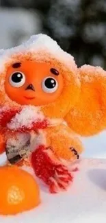 Adorable orange toy in snow, winter theme wallpaper.