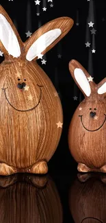 Two cute wooden bunny figures on a black background.