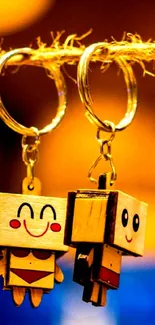 Cute wooden keychain figures hanging with joyful expressions.