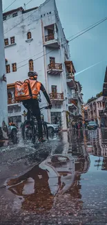 Cyclist rides through vibrant city street with reflections in wet pavement.