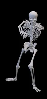 Dancing skeleton on black background.