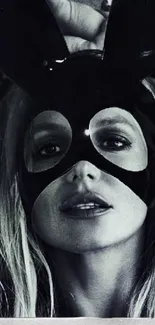 Dangerous Woman album cover featuring a mysterious mask.