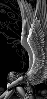 Dark angel with wings and skulls in black and white wallpaper.