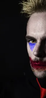 Dark aesthetic clown with bold face paint.