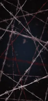 Barbed wire art on dark background wallpaper.