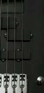 Closeup of dark bass guitar strings on mobile wallpaper.