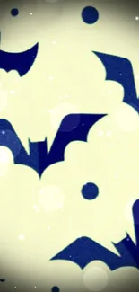 Dark bats fly across a yellow background in this mystical wallpaper.