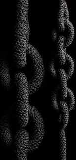 Dark textured chains forming a striking wallpaper design