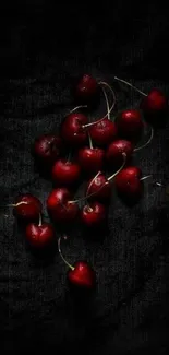 Elegant dark cherries on a black background wallpaper.