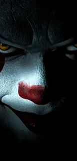 Dark, eerie wallpaper featuring a menacing clown face.